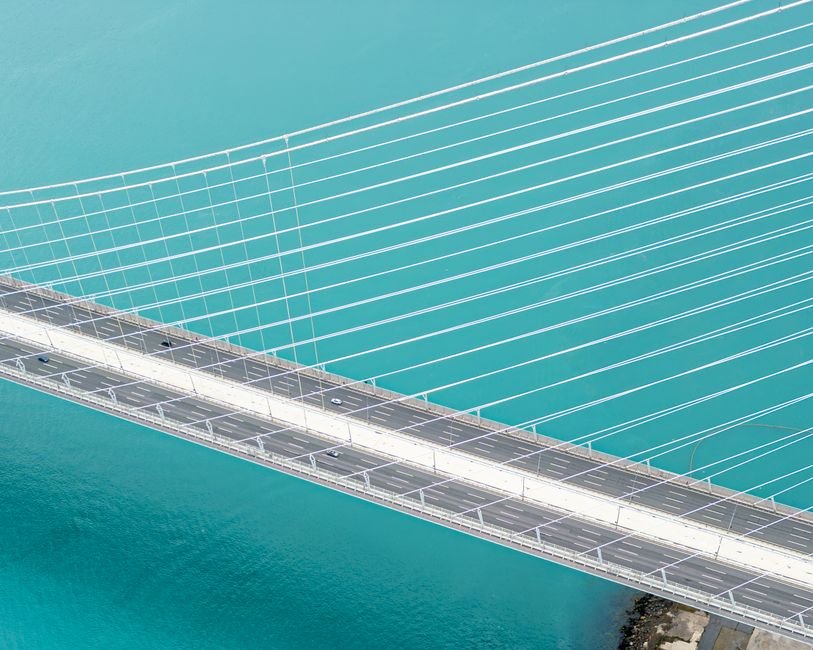 Stunning aerial shot of the Yavuz Sultan Selim Bridge over the Bosphorus in Türkiye with turquoise waters.